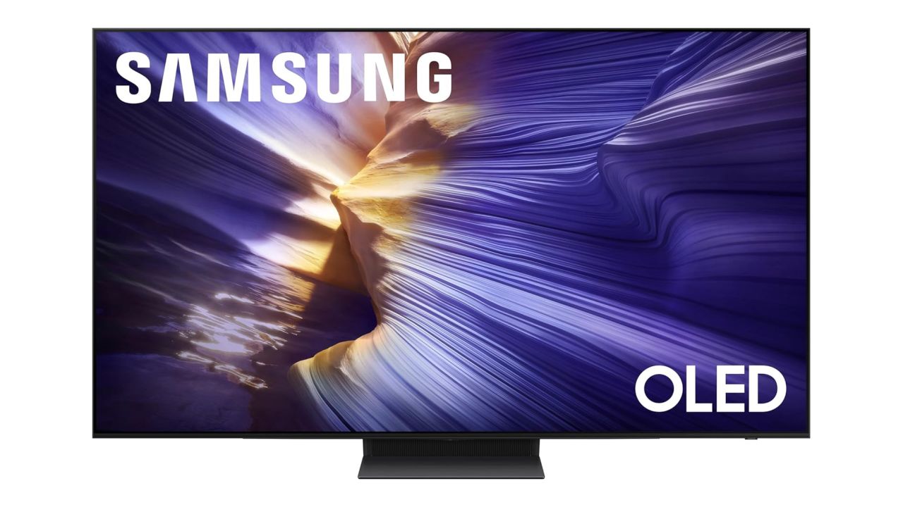 A Samsung S90F OLED TV, with a purpleish canyon image on screen
