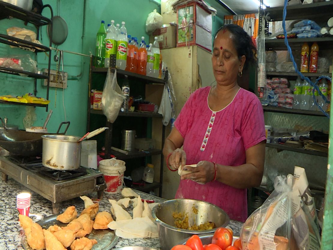 Poonam Shah works at her street food stall in Delhi’s Chanakyapuri neighborhood on May 30, 2024.