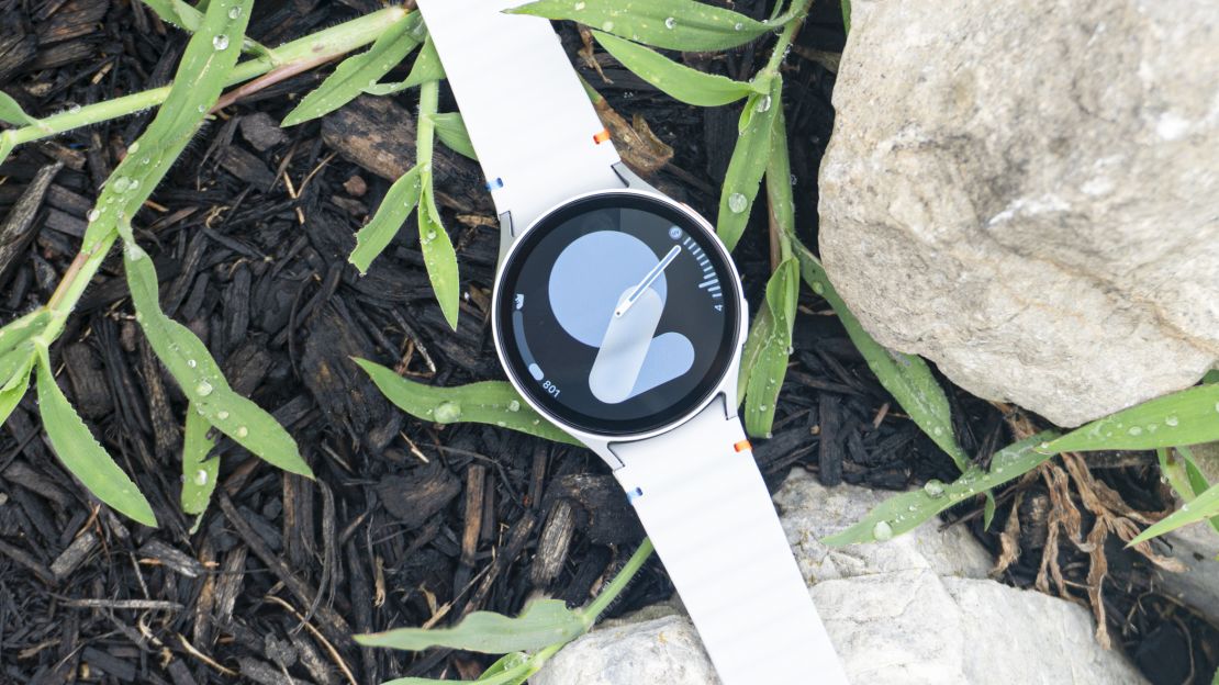 Samsung Galaxy Watch 7 with rocks and plants behind.