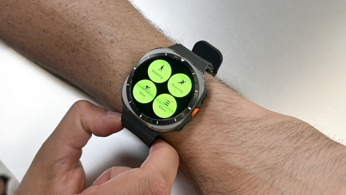 the Samsung Galaxy Watch Ultra on a wrist, open to the workouts menu