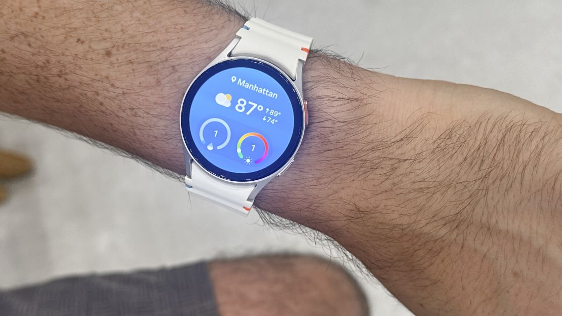 the white Samsung Galaxy Watch 7 is open to the weather widget