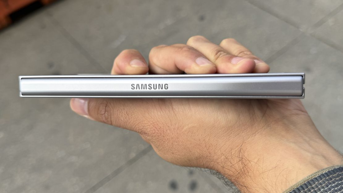 The Samsung logo can be seen on the Samsung Galaxy Z Fold 6's hinge, seen here as the phone is closed and held in hand.