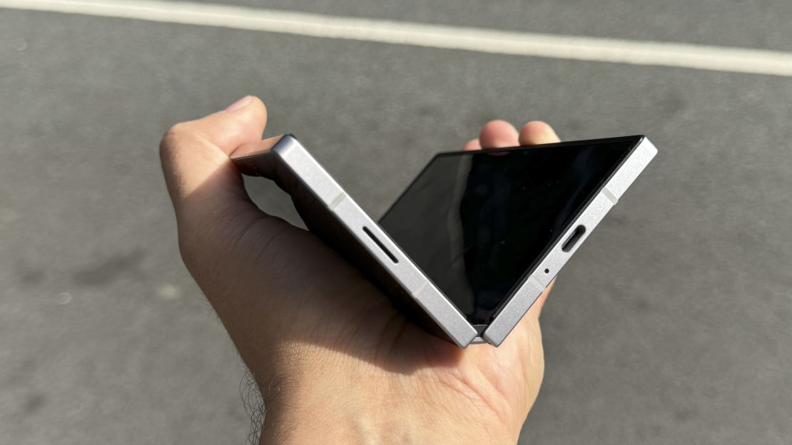 Samsung Galaxy Z Fold 6 seen from below, half-open in hand