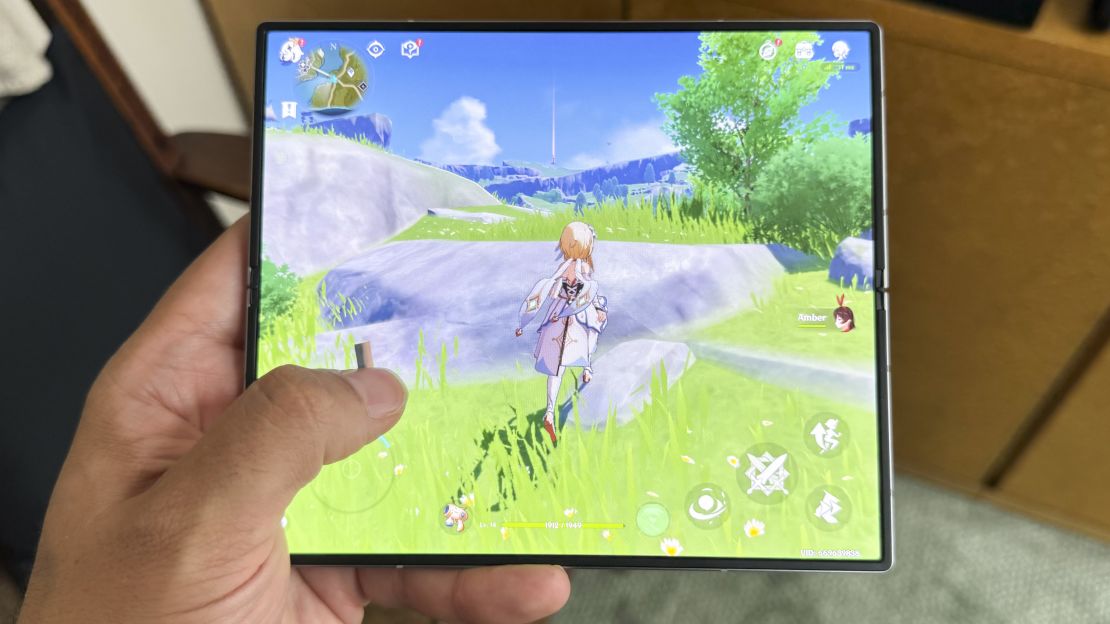 A pixie-like character runs in Genshin Impact seen on the Samsung Galaxy Z Fold 6