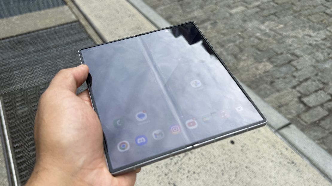 The Samsung Galaxy Z Fold 6 is opened and its screen is slightly dimmed, so its center crease is more visible