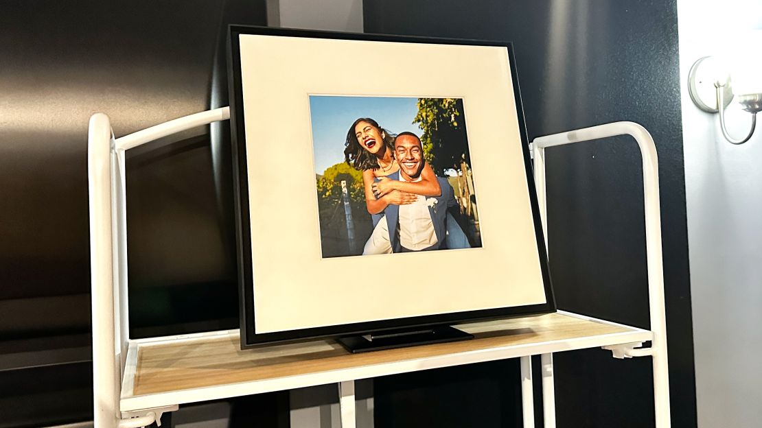 Samsung's Music Frame displays a woman with her arms wrapped around a man's shoulders.