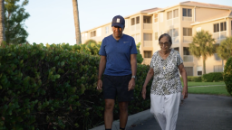 Dr. Sanjay Gupta and his mom walk in Fort Myers, Florida.