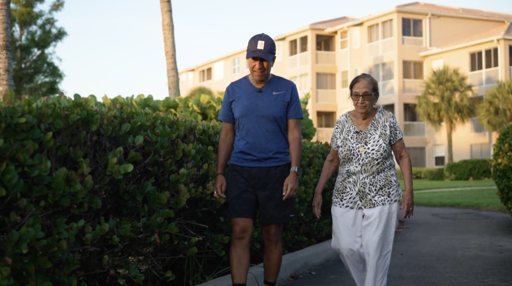 Dr. Sanjay Gupta walks with his mother, Damyanti Gupta, near her home in Fort Myers, Florida. After recovering from a broken vertebra, Mrs. Gupta says her early morning walks help keep pain away.