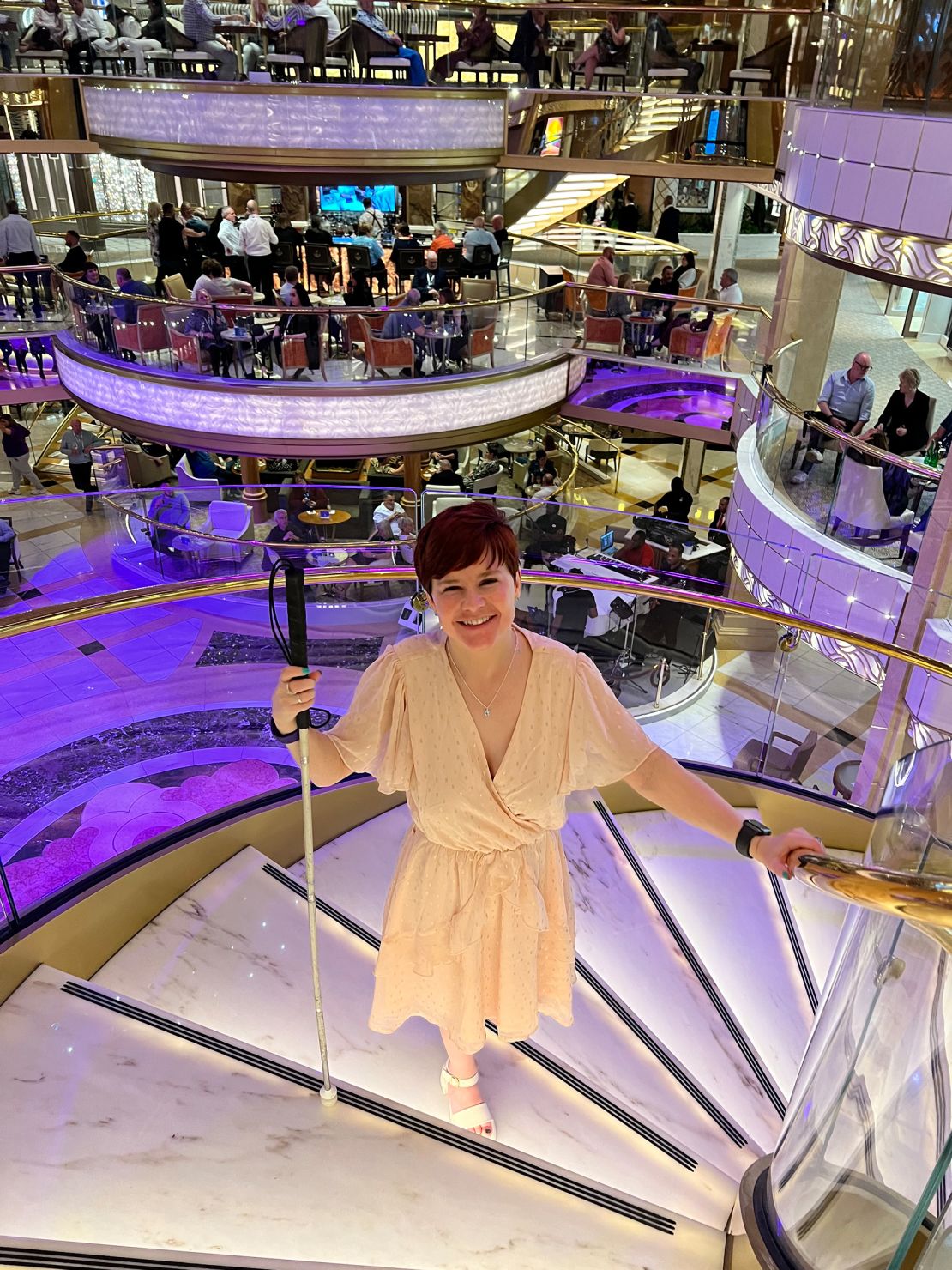 Wyatt is pictured on a spiral staircase on board a cruise ship.