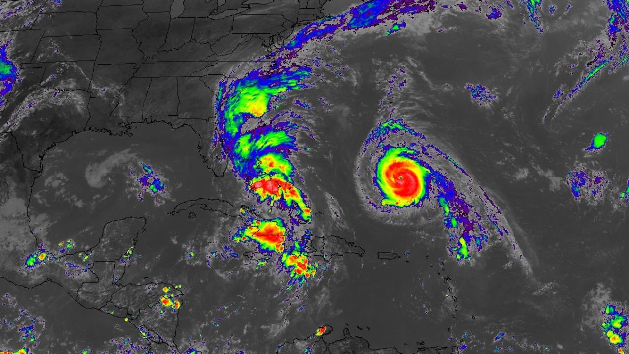 This satellite view from Sunday afternoon shows Hurricane Humberto on the right and Tropical Storm Imelda over the Bahamas.
