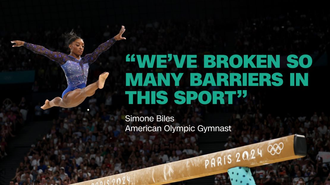 Simone Biles elevates over the beam during the 2024 Paris Olympics.