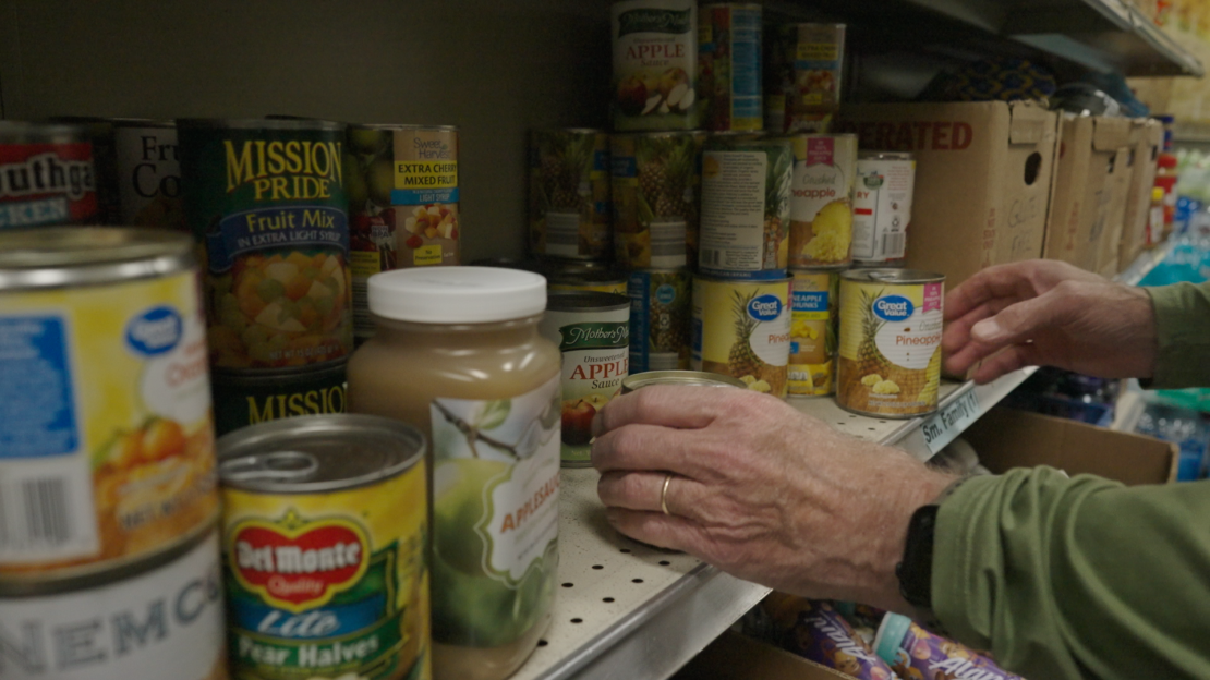 A volunteer organizes food donations at the Swannanoa Valley Christian Ministry.