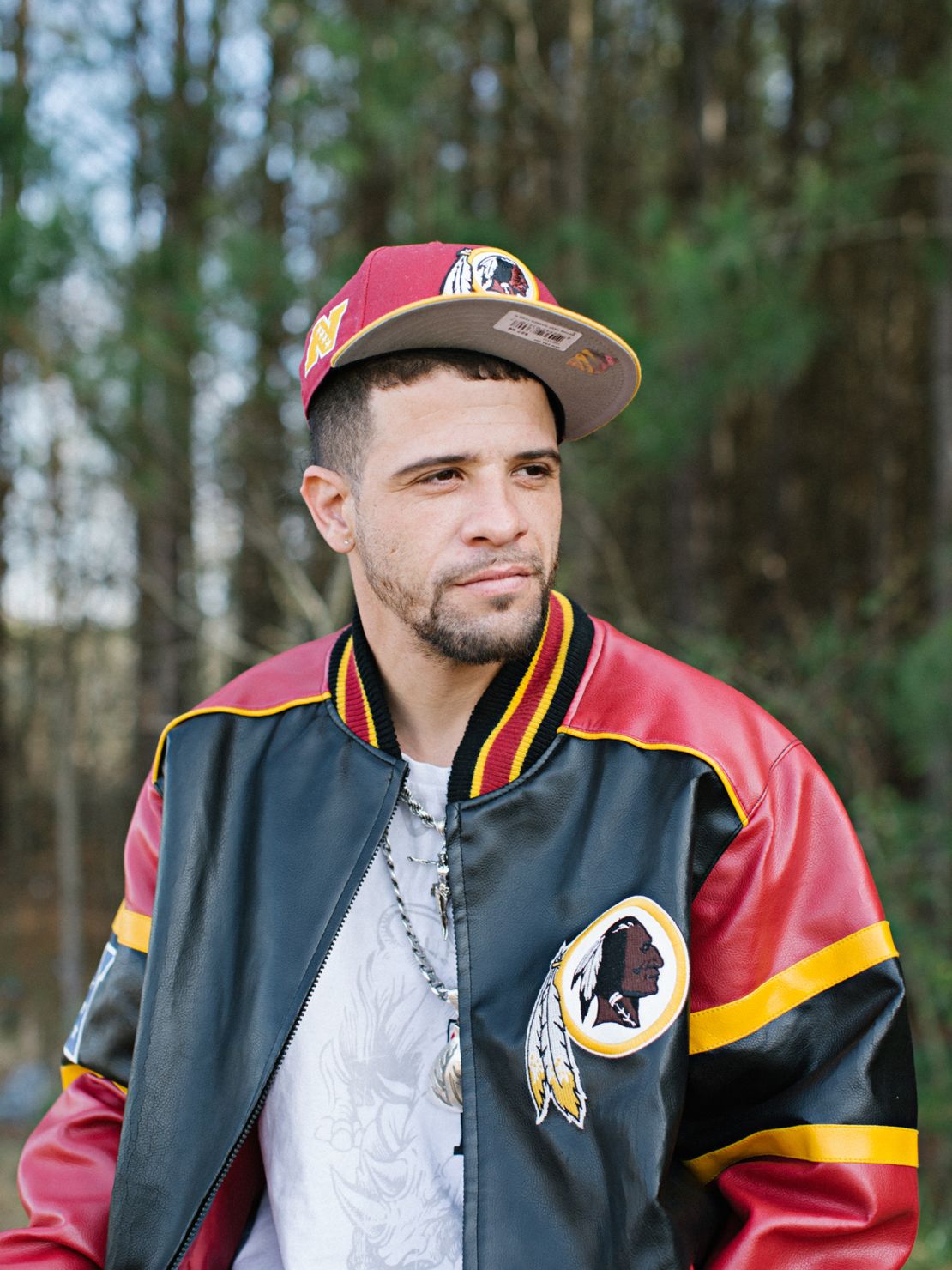 Scottie wears a Washington Redskins jacket. Though many Native people would consider the imagery offensive, Sturm said he saw the jacket as a reflection of his identity.
