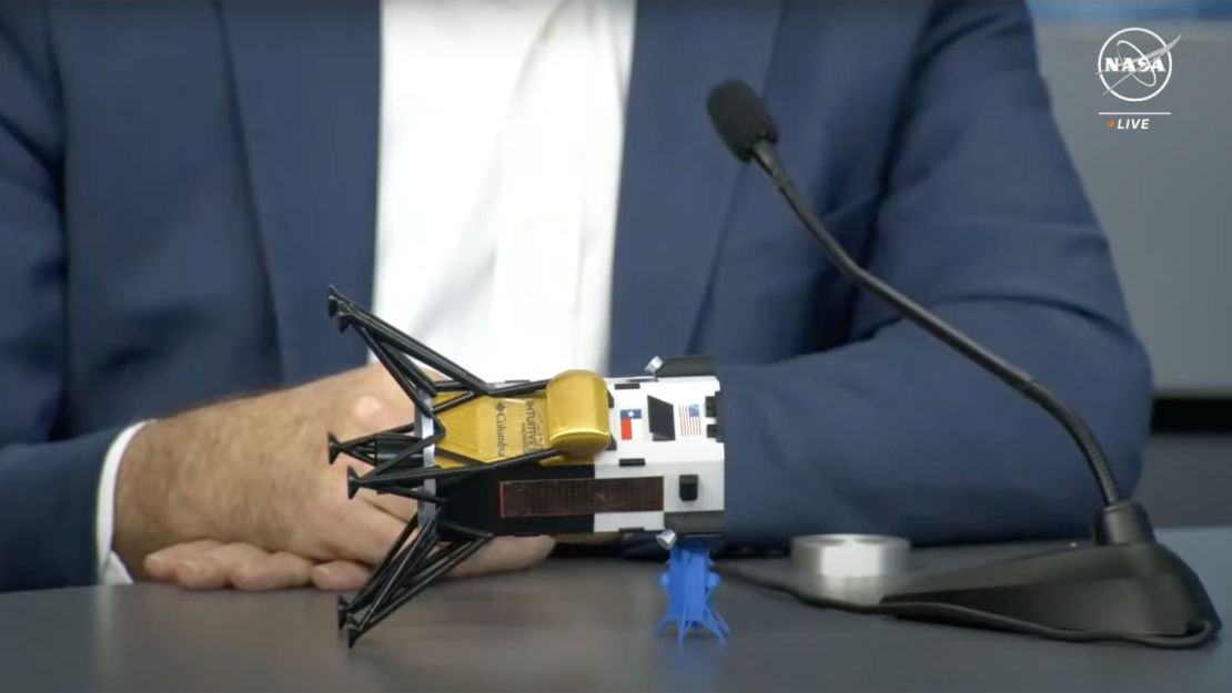 Steve Altemus, chief executive officer and cofounder of Intuitive Machines, uses a model to represent how the Odysseus spacecraft landed on the moon.