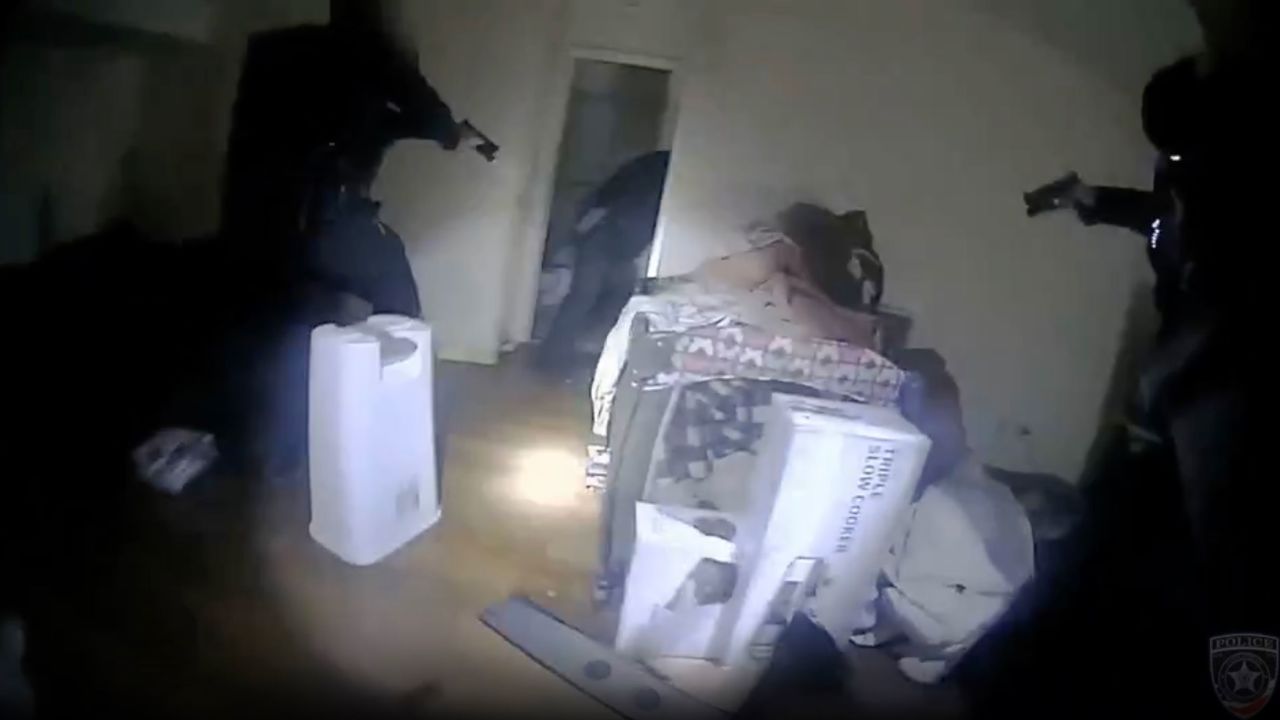 An image taken from body camera video shows the moments police in Illinois shot and killed a man inside his apartment bedroom.