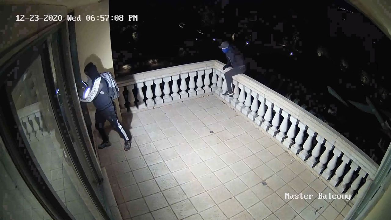 A group of thieves is seen breaking into the Starr's home through a window in the upper bedroom in a video released by the Orange County D.A.