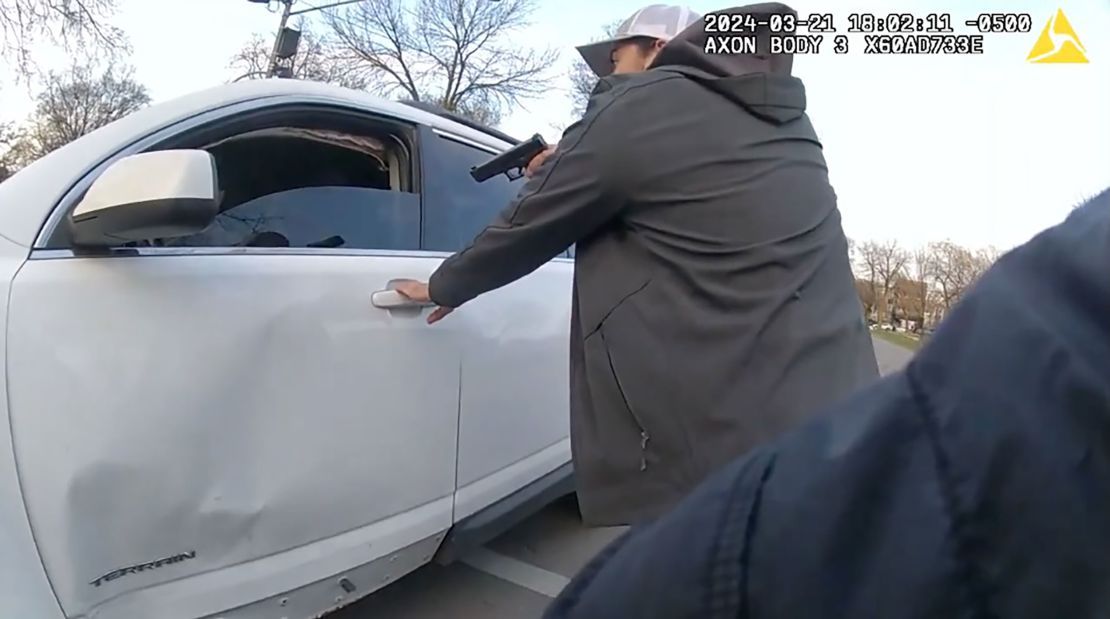 A Chicago police officer gives Dexter Reed several commands before gunfire breaks out.