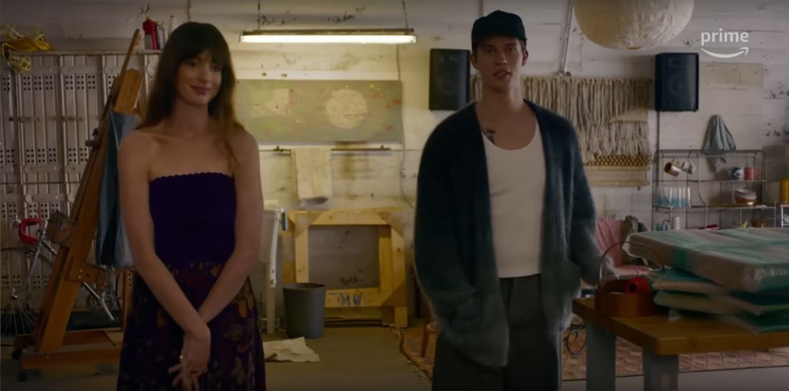 When Hayes tracks Solène down at her art gallery, Hathaway wears a vintage Chanel dress while Galitzine is dressed in a Isabel Marant cardigan.