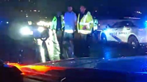A dashcam video released by police showed Scottie Scheffler being escorted in handcuffs.