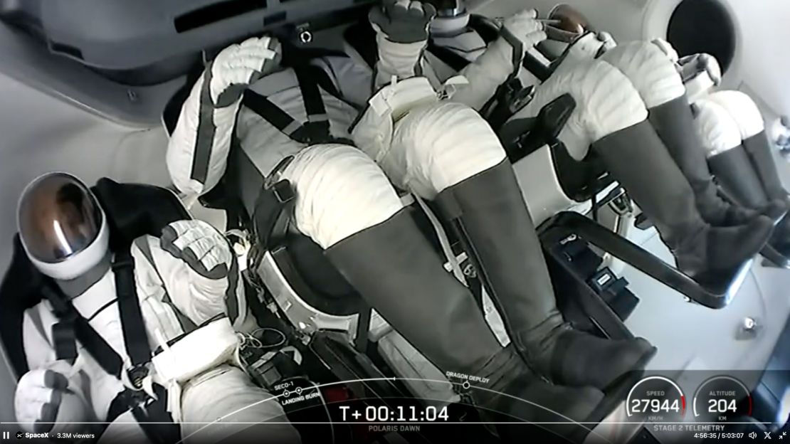 In this screenshot from video, the Polaris Dawn crew sit in the Dragon capsule shortly after launching towards space on Tuesday.