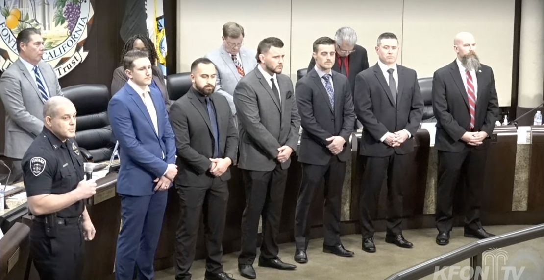 Kyle Guthrie, far right, is seen during an award ceremony during a city council meeting after his deposition.