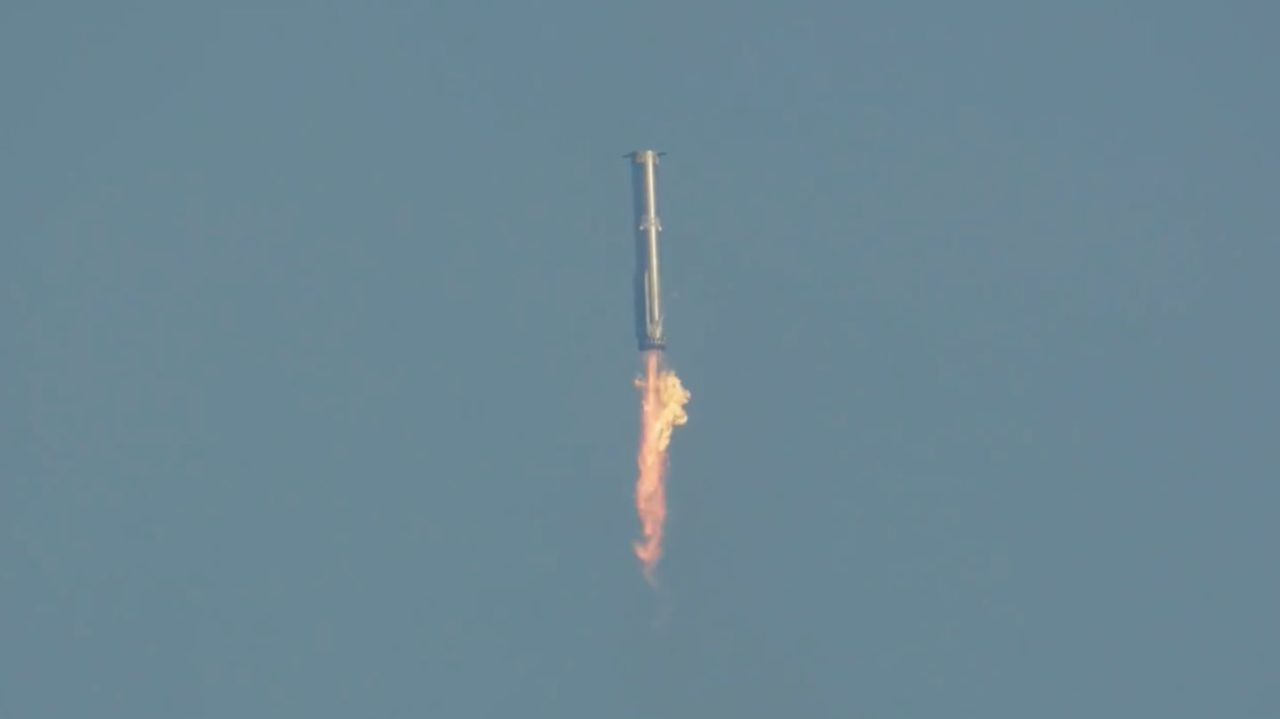 A still from SpaceX's livestream shows the Super Heavy rocket booster heading back down to Earth on Tuesday.