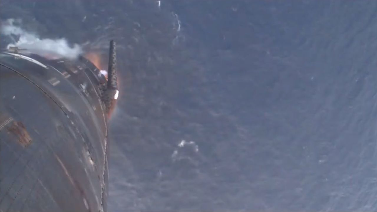 A still from SpaceX's livestream shows Starship splashing down in the Indian Ocean.