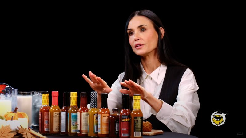 Demi Moore is ‘Hot Ones’ queen, asking host Sean Evans if he has anything ‘stronger’ after acing spicy sauce ‘gauntlet’ | CNN