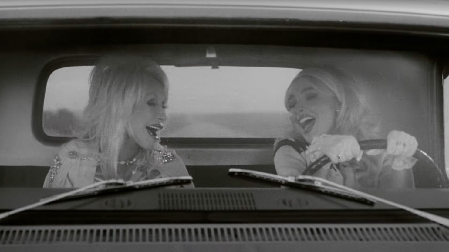 Dolly Parton and Sabrina Carpenter in the music video for "Please Please Please ft. Dolly Parton."