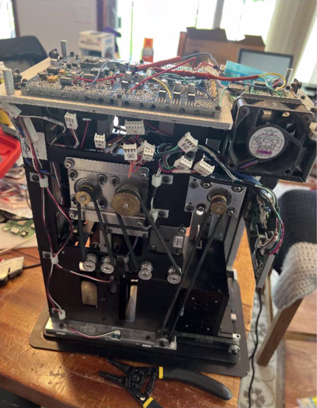 This image shows a shuffling machine taken apart on a table. The Department of Justice says it is part of the rigged technology that was employed by the conspirators in the case.