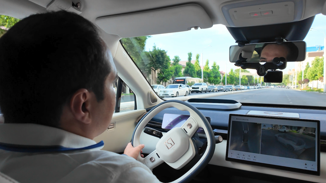 Timur Chutbaev drives an electric SUV manufactured by Chinese automaker Zeekr.