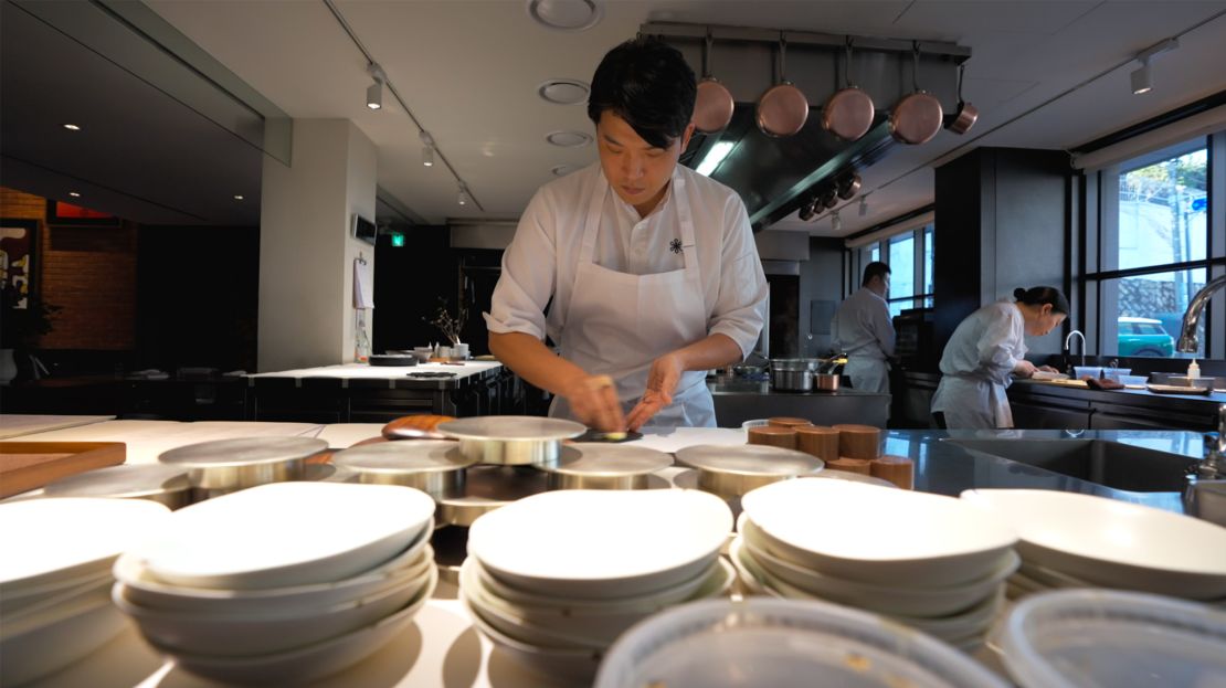 Chef Sung prepares for service at Mosu Seoul.