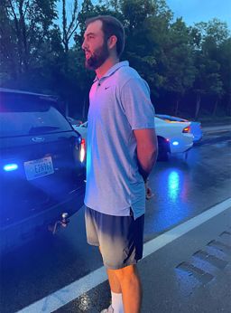 An Image of Scottie Scheffler in handcuffs after his arrest, released by Louisville Metro Police Department