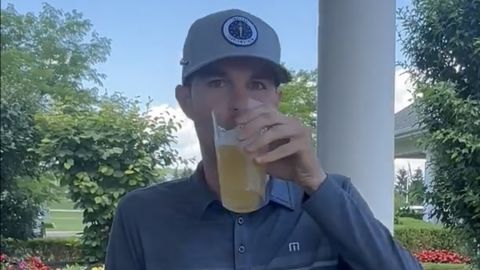 Nick Bienz sips a beer before heading into a playoff to qualify for the PGA Tour's Rocket Mortgage Classic, in a video shared by Ryan French of Monday Q Info on X.