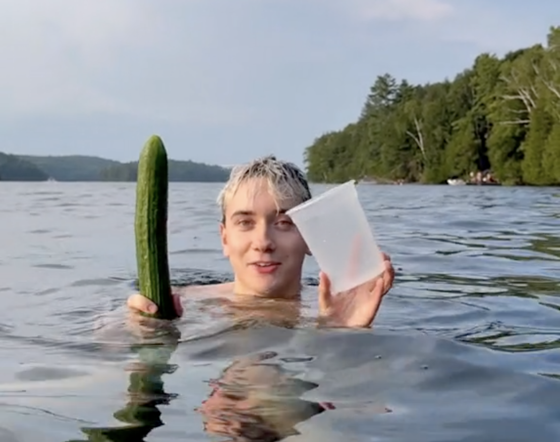 Sometimes you need to eat an entire cucumber, even in the middle of a lake.