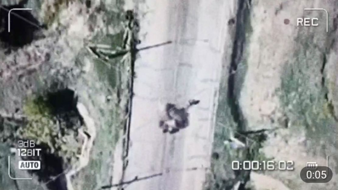 This video posted by a Russian military blogger, geolocated by CNN, shows an explosive device being dropped on a Ukrainian woman riding a bicycle in Antonivka.