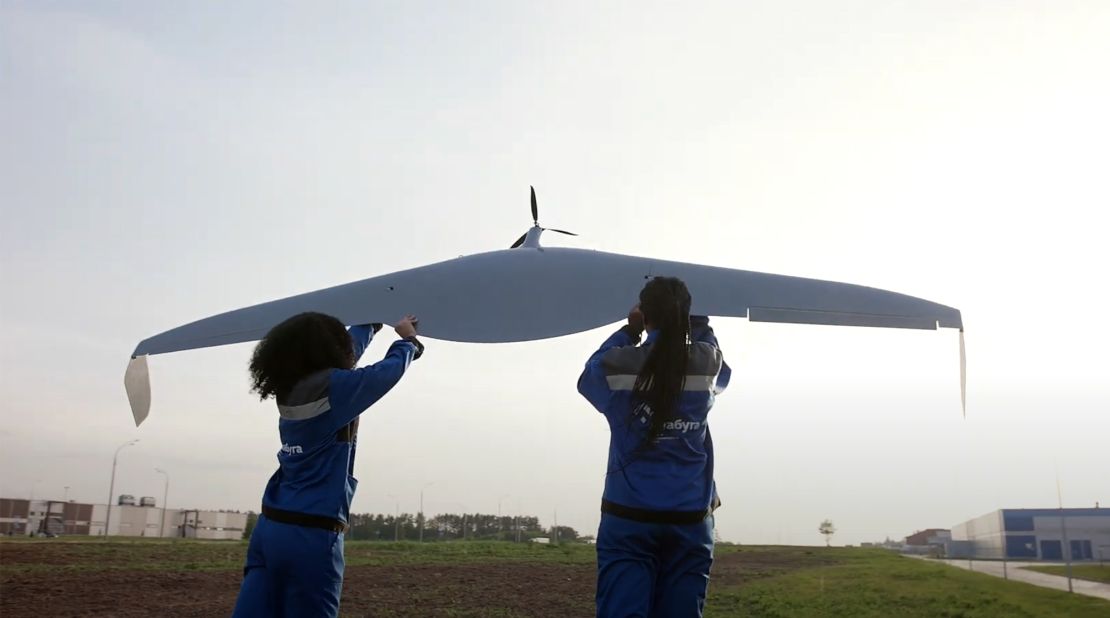 A screen grab from a promotional video shared on the Alabuga Start Program Telegram channel in June 2023, and also on Alabuga's website, showing women assembling and then launching a drone.