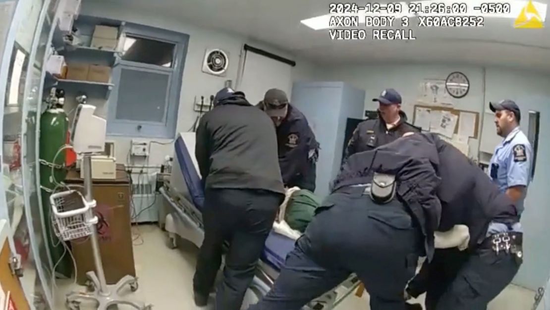 Robert Brooks is restrained by correctional officers at the Marcy Correctional Facility.