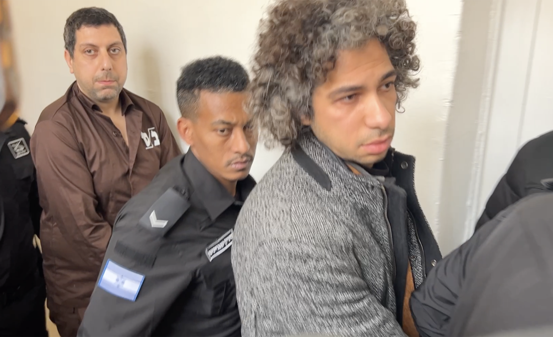 Mahmoud Muna (left) and his nephew, Ahmed, being escorted by Israeli security at a Jerusalem courthouse last month.