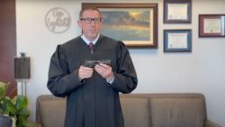 In this screengrab taken from a video, Judge Lawrence VanDyke holds a gun in a video uploaded on March 20, 2025 as a part of his dissent in 23-55805 Duncan v. Bonta, an opinion ruling that California’s law banning gun magazines that hold more than 10 rounds of ammunition can remain in place. The 9th US Circuit Court of Appeals ruled 7-4 that the law was permissible under the Second Amendment because large-capacity magazines are not considered “arms” or “protected accessories.”