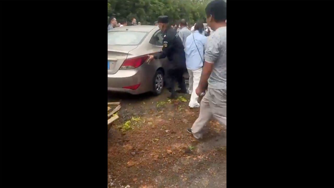 The scene after a car plowed into a crowd of people outside a school in Jinhua in the province of Zhejiang, China, on Wednesday.