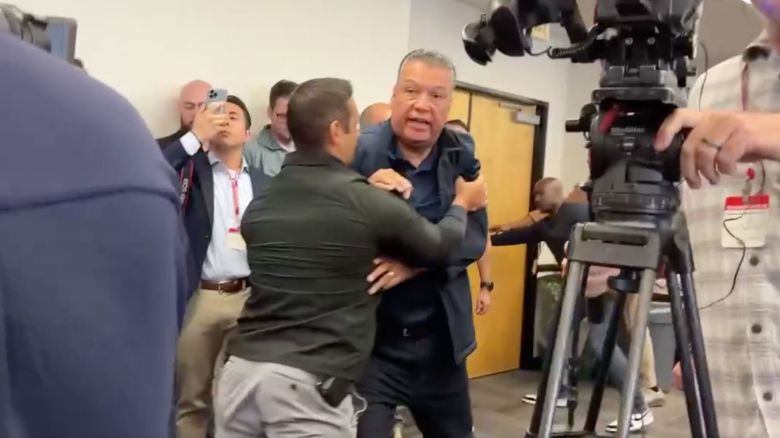 Sen. Alex Padilla is escorted out of a press conference with US Secretary of Homeland Security Kristi Noem on June 12 in Los Angeles.