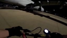 This screengrab of a video by the group Palestine Action, posted to X on Friday, June 20, 2025, shows an activist approaching an aircraft at RAF Brize Norton, in Oxfordshire, central England.