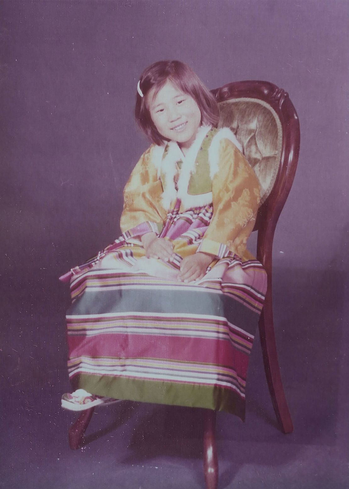 Bender, after her adoption by American parents, is wearing the shoes her birth mother Han bought for her.