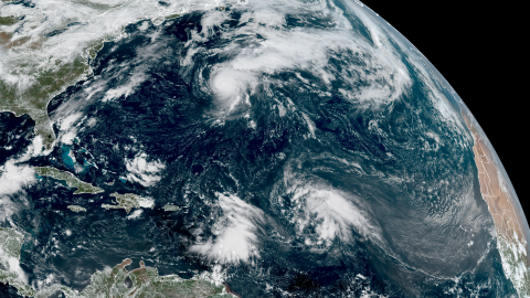 Hurricane Gabrielle churns east of Bermuda while two areas of disorganized storminess lurk east of the Caribbean Tuesday afternoon.
