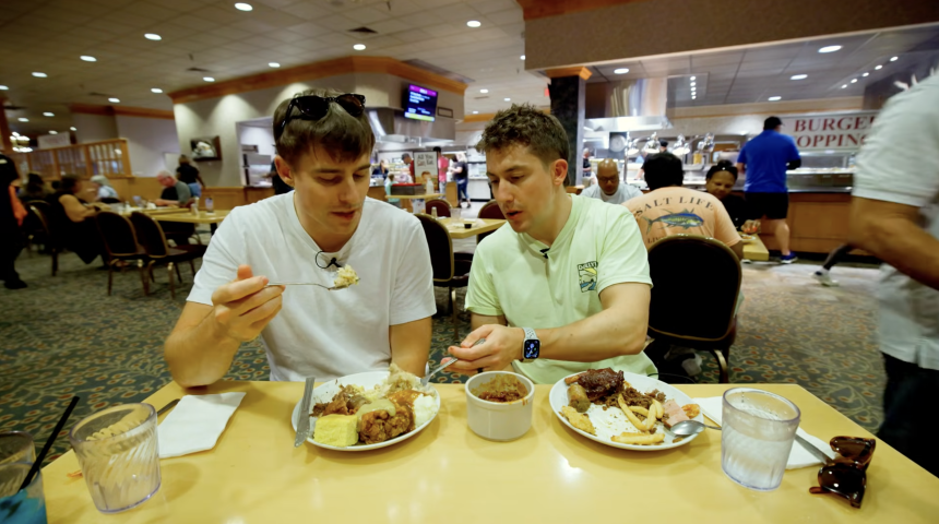 This screenshot from JOLLY's youtube episode shows Joshua Carrott and Ollie Kendal trying buffet food on their youtube channel.
