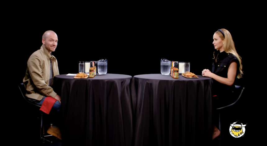 This screengrab shows First We Feast's Hot Ones episode with Sean Evans and Jennifer Lawrence.