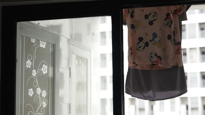 In a former scam compound in the Philippines, clothing hangs in one of the worker dorms, long after the site was shut down.