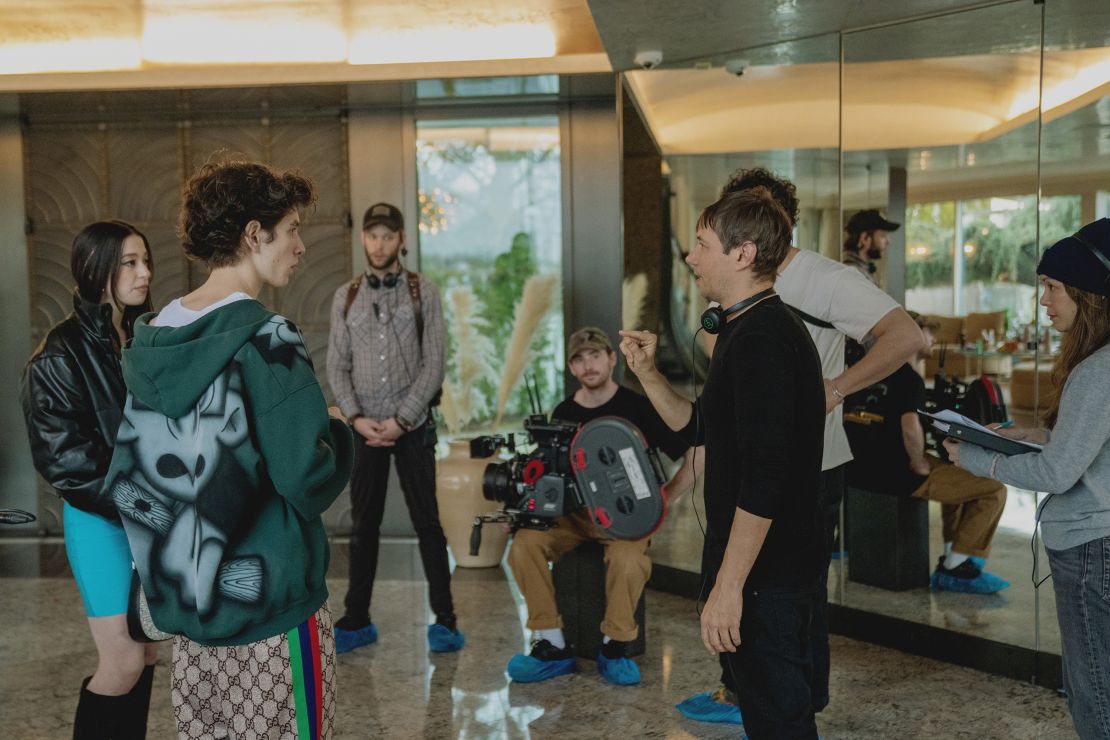 Sean Baker directs Mikey Madison and Mark Eydelshteyn on the set of “Anora.”