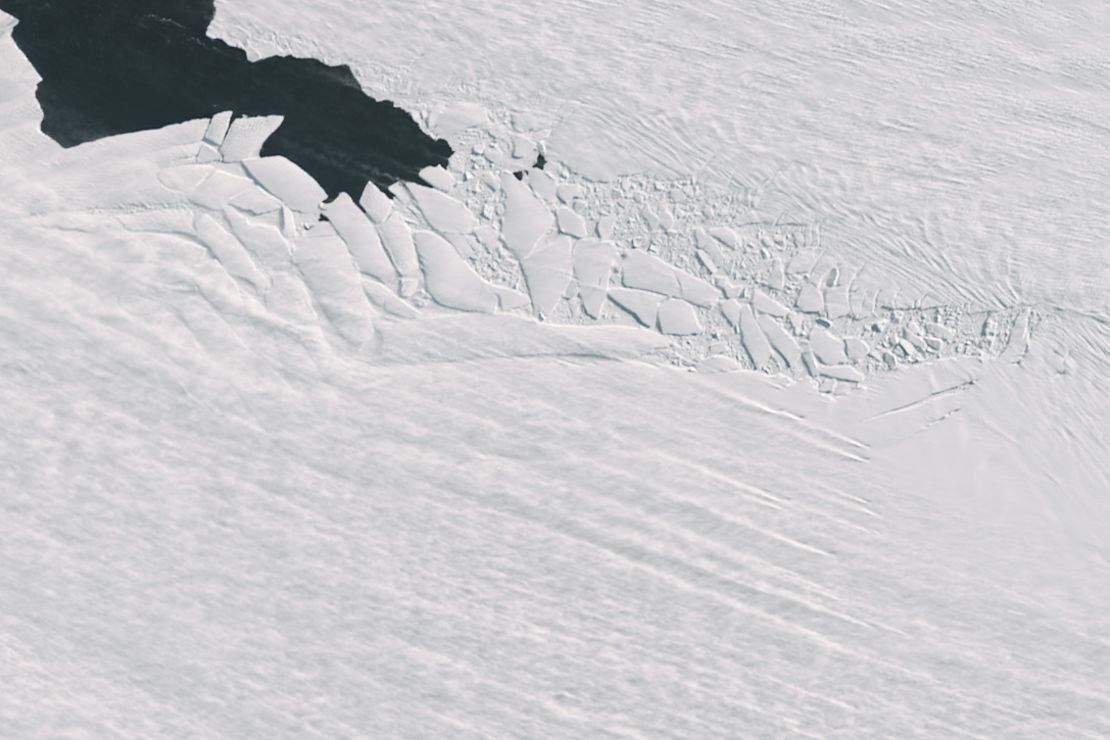 Strong winds blow snow into stark lines across Pine Island Glacier.